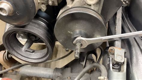That's the pulley for the power steering pump. . How to fix a wobbly power steering pulley